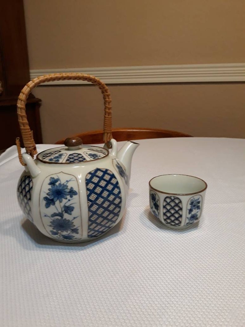 Blue and white Asian teapot with teacup