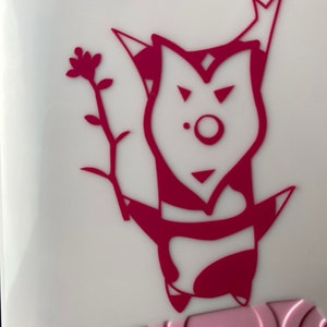 May include: A pink and white phone case with a pink cartoon character holding a flower. The character has a crown on its head and a large, round nose.