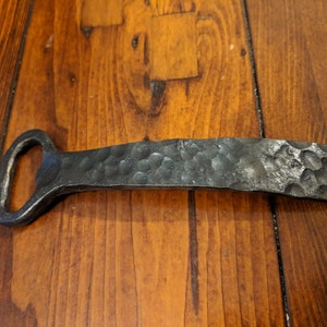 Hand forged bottle opener