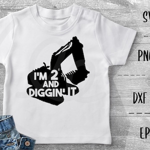 May include: White t-shirt with a black silhouette of an excavator and the text "I'm 2 and Diggin' It"