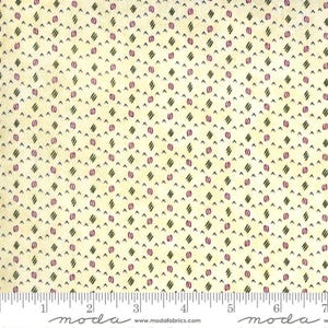 May include: Cream-colored fabric with a repeating pattern of dark green diagonal lines, small purple ovals, and tiny black triangles. The fabric has a grid-like design. A ruler is at the bottom of the image.