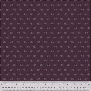 May include: A dark purple fabric with a repeating pattern of small white flowers.