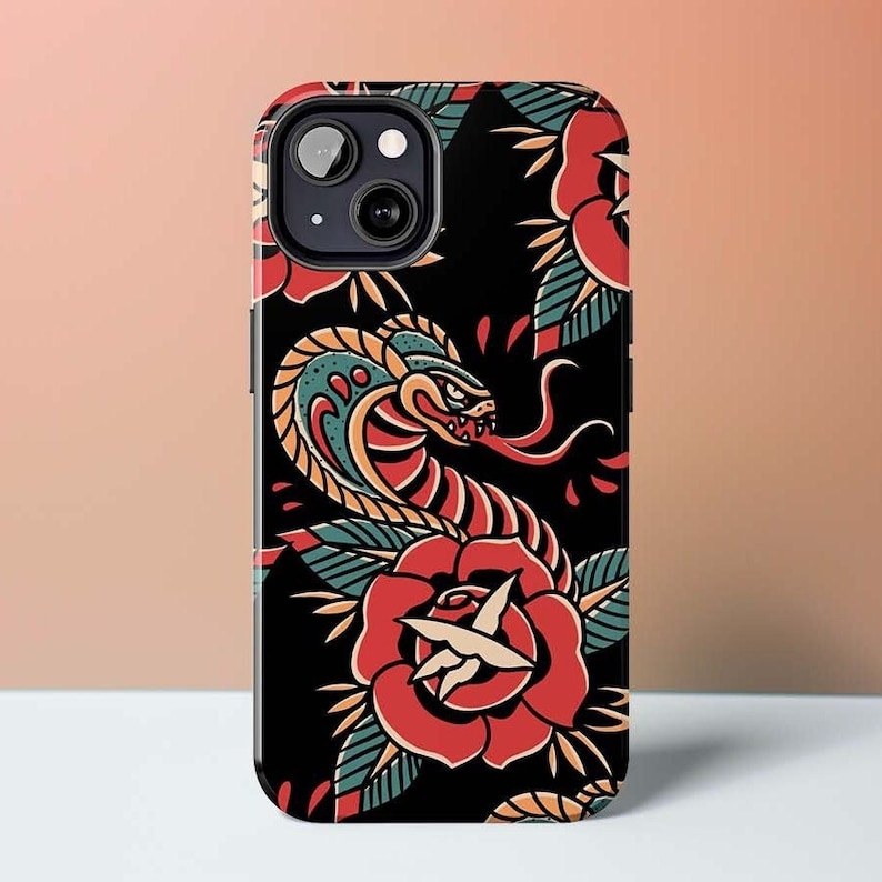 May include: Black phone case with a colorful tattoo design featuring a snake and roses.