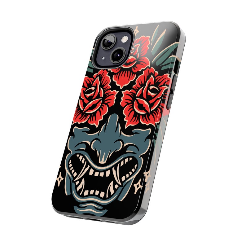 May include: Black phone case with a graphic of a red and green floral design and a blue and green demon face.