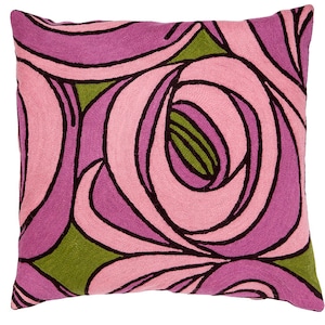 May include: A pink and green cushion with a floral pattern. The cushion is made of a soft, textured fabric and features a unique, abstract design.