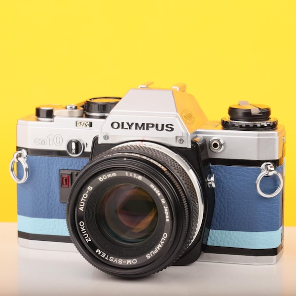 Olympus OM10 Slr Vintage 35mm Film Camera with Zuiko 50mm f/1.8 Prime Lens Reconditioned With New Blue Leather Skin
