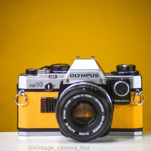 Olympus OM10 Vintage Film Camera with 50mm f/1.8 Lens and  Manual Adapter With New Leather Skin