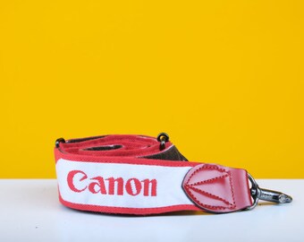 Dragonne pour appareil photo Canon en rouge et blanc