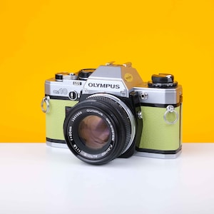 Olympus OM10 SLR 35mm Film Camera with Zuiko 50mm f1.8 Prime Lens Reconditioned with New Lime Leather Skin