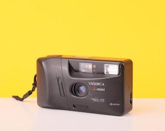 Yashica J-mini 35 mm-filmcamera: richten en fotograferen