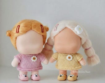 Knitted dress for vinyl face plush doll