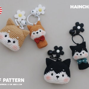 May include: Three crocheted dog keychains with flower charms. The dogs are brown, orange, and black. The keychains are approximately 5 cm and 6 cm tall. PDF pattern included.