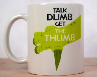 Talk Dumb Get the Thumb Iguanodon Coffee Mug