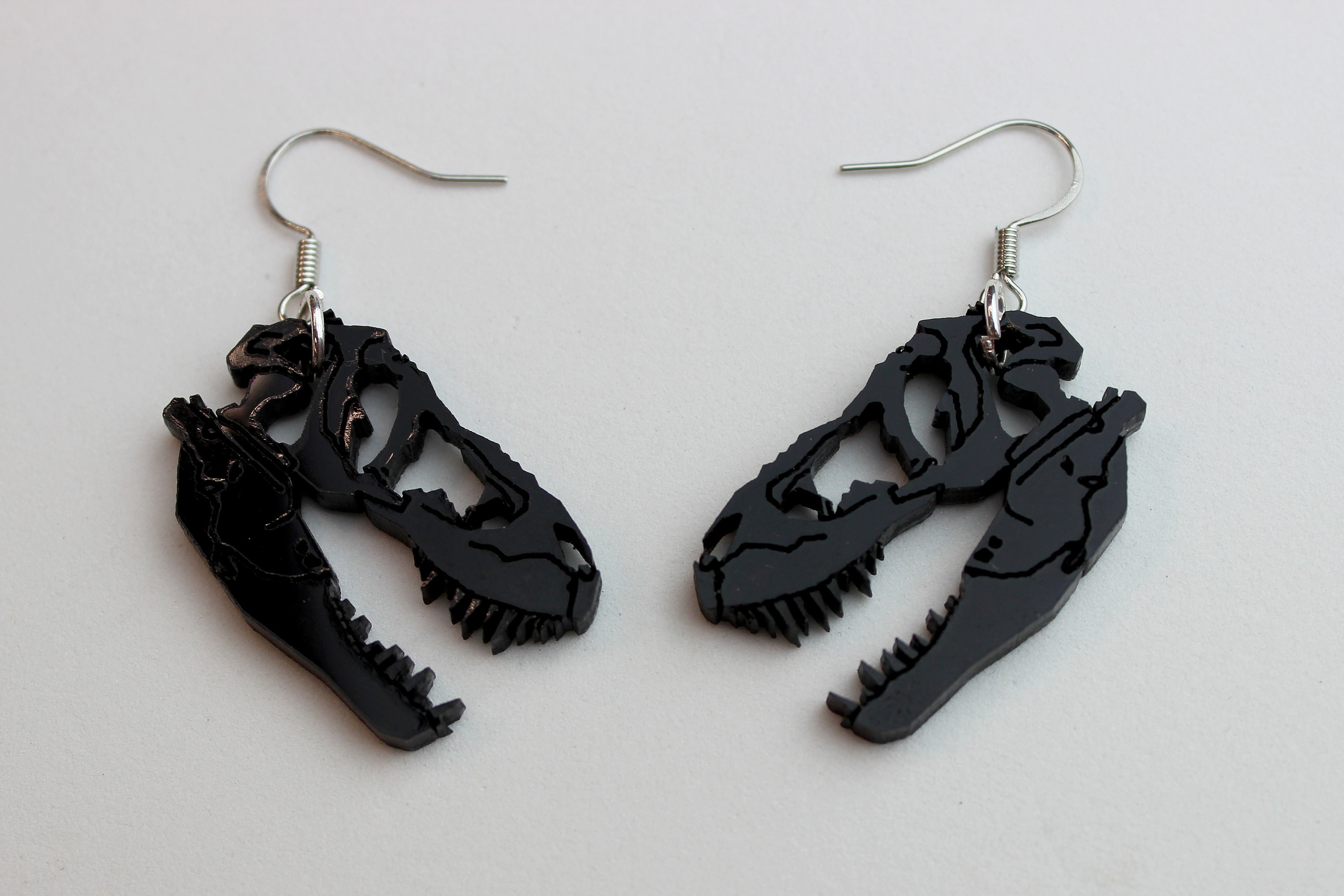 T store rex earrings