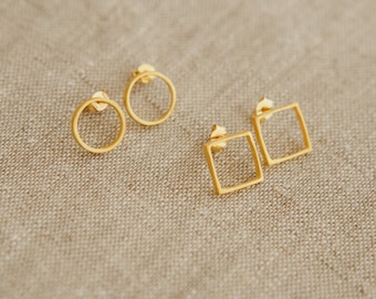 May include: A set of gold-toned earrings featuring two simple circle designs and two square designs.