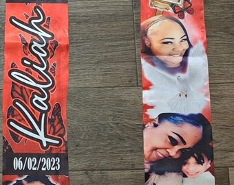 May include: Red and white satin memorial scarf with a butterfly design. It features photos of a woman and a child, along with the text "In Loving Memories 06/05/1980 Kalilah 06/02/2023".