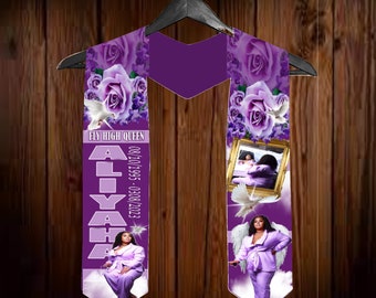 May include: Purple graduation stole with a white dove, a photo of a woman, and the text "Fly High Queen Aliyah 08/10/1995 - 03/08/2023"