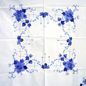 Vintage tablecloth with hand-crafted floral motifs in blue