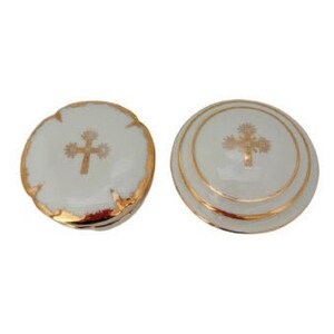 May include: Two white ceramic trinket boxes with gold trim and a gold cross design.