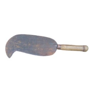 May include: A rusty metal gardening tool with a wooden handle. The tool has a curved blade and is used for weeding or cultivating.