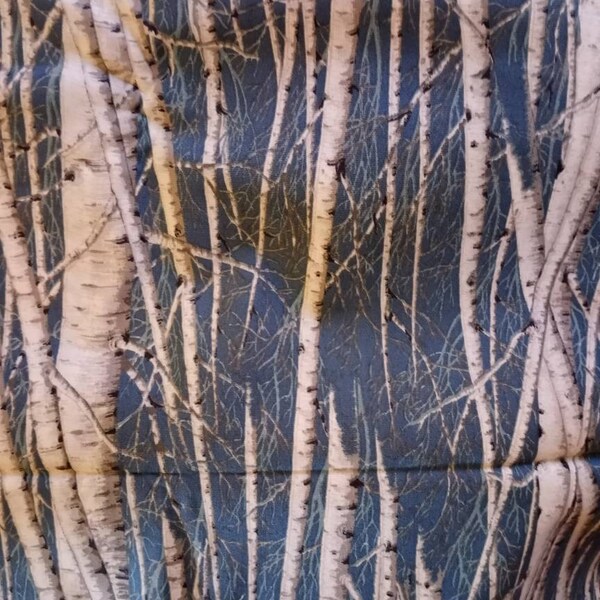 White Tree Trunks on Blue Fabric