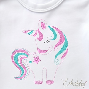 May include: White baby onesie with an embroidered pink and teal unicorn with a rainbow mane and tail. The unicorn has closed eyes and is standing on all four legs. The onesie has the text "Embroiderling by RivusDea" in the bottom right corner.