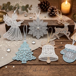 May include: A collection of six intricate lace Christmas ornaments featuring an angel, a snowflake, a reindeer, a Christmas tree, a bell, and a mitten. Each ornament is crafted with delicate white and light blue thread work and includes a hanging loop.