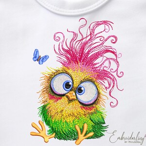 May include: Embroidered design of a colourful cartoon bird with large eyes and a pink, yellow and green feathered head. The bird is sitting on its feet with its wings tucked in. A small blue butterfly is flying above the bird.