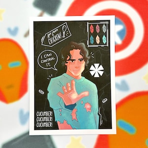 May include: A print featuring a stylized illustration of a person in a teal shirt with the text "I can control it." and "Cucumber!" The background is black with white accents and the words "Hot Crispy Chicken!"