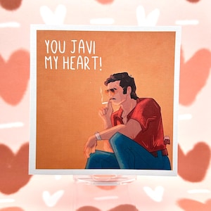 May include: A card featuring a cartoon illustration of a man with a moustache smoking a cigarette. The card reads "You Javi My Heart!"