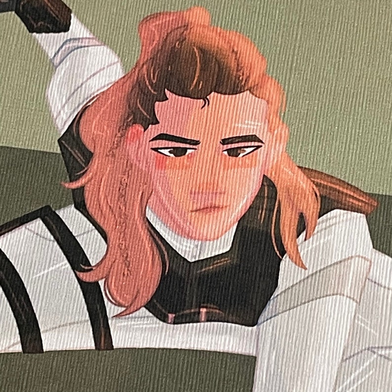 May include: A woman with long brown hair is wearing a white and black outfit. She has a serious expression on her face.