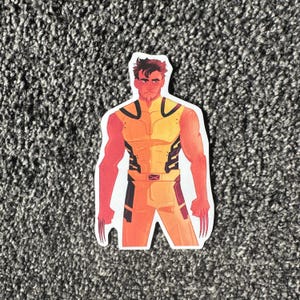 May include: A yellow and orange character with black accents and claws. The character has a serious expression and is wearing a yellow and orange suit with black accents.