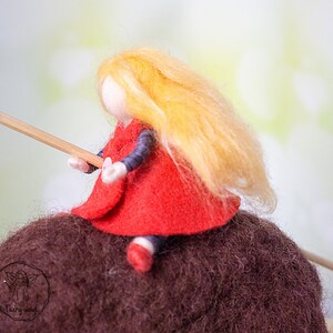 Felt sculpture of wild brown bear and tiny girl in red cloak. The figurine of huntress with lamp. image 5