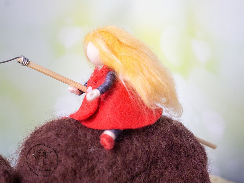 Felt sculpture of wild brown bear and tiny girl in red cloak. The figurine of huntress with lamp. image 5