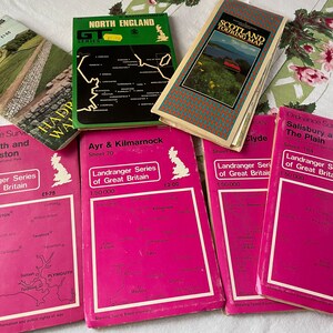 May include: A collection of vintage maps of Great Britain, including Plymouth and Launceston, Ayr and Kilmarnock, Salisbury and the Plain, and Scotland. The maps are pink and green and feature the Landranger Series of Great Britain.