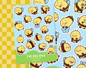 May include: A sticker sheet with a blue background featuring various cartoon bees in different poses. The bees are yellow with black stripes and have different facial expressions. The sheet is titled "The Bee Hive Sticker Sheet".