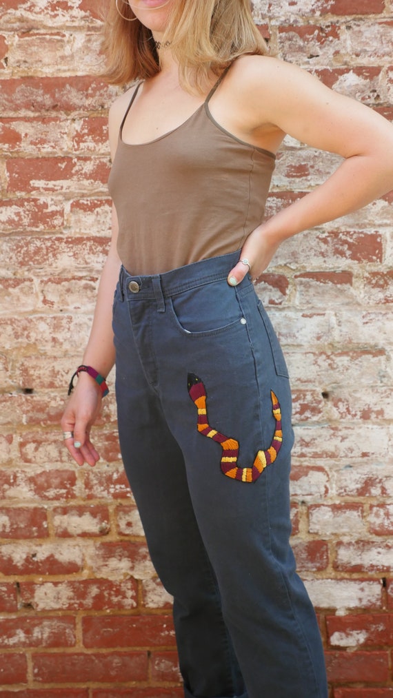 snake embroidered jeans