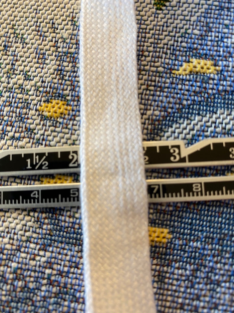 May include: White cotton twill tape measuring 1 1/2 inches wide.