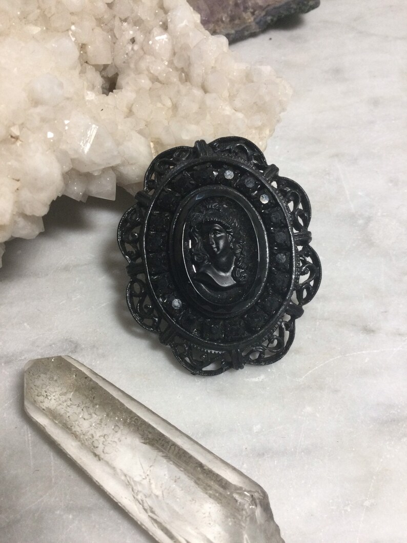 black glass and blackened steel 1980\u2019s Victorian Revival gothic black cameo brooch retro metal punk goth