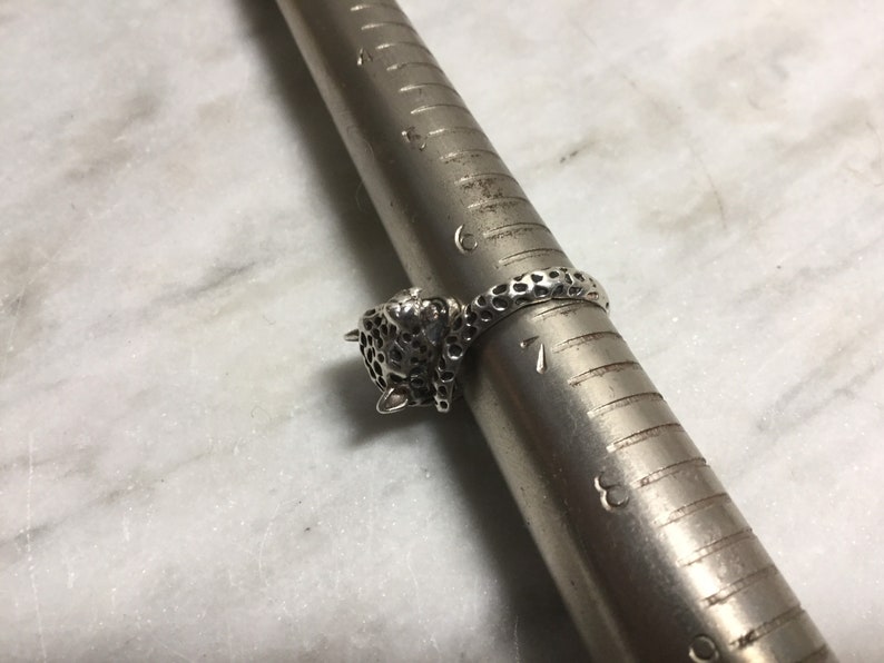 cat Marked on the interior Vintage sterling silver ring of a leopard biting its own tail Size 6.5 Statement ring