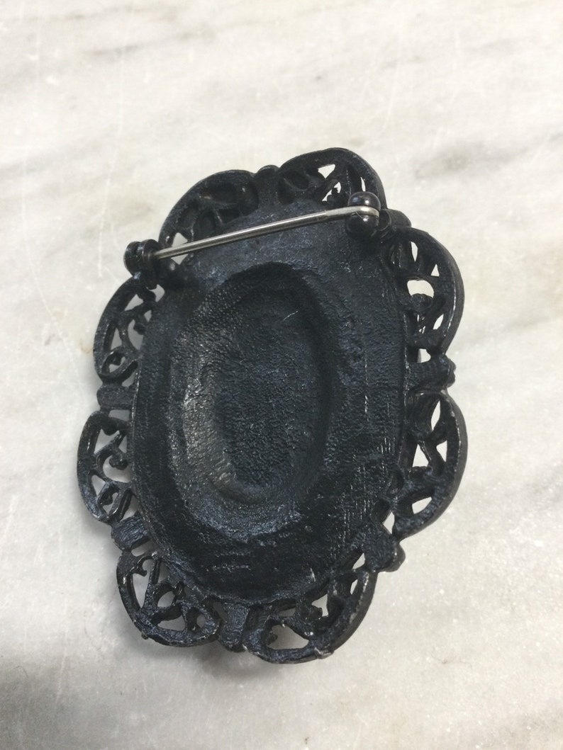 black glass and blackened steel 1980\u2019s Victorian Revival gothic black cameo brooch retro metal punk goth