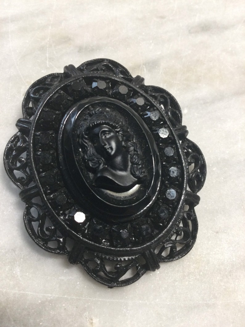 black glass and blackened steel 1980\u2019s Victorian Revival gothic black cameo brooch retro metal punk goth