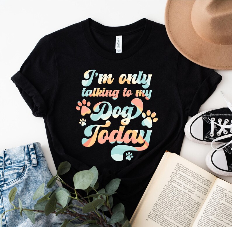 May include: Black t-shirt with a retro-style graphic that says "I'm only talking to my dog today".