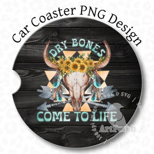 May include: A black and white car coaster with a wooden background. The design features a skull with a floral headdress and the text "DRY BONES COME TO LIFE".