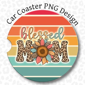 May include: A round car coaster with a sunset stripe design. The text "blessed mom" is in the center of the coaster with a sunflower in between the words. The letters are brown with a leopard print pattern.