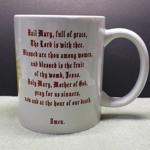 Catholic Mug in Red IHS in the center of the Our Father and the Hail Mary
