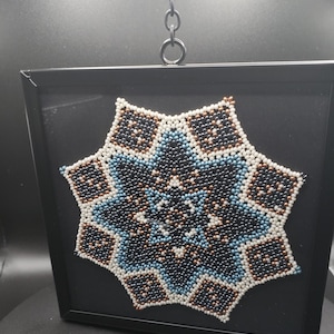 Obra de arte de tapete con cuentas