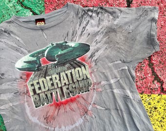 May include: Gray tie-dye t-shirt with a graphic of a spaceship and the text "TRADE FEDERATION BATTLESHIP".