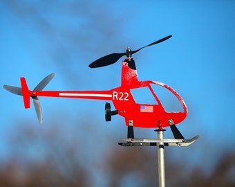Helicopter weathervane, windmill, whirligig. This one is semi scale of a Robinson R22 R44.