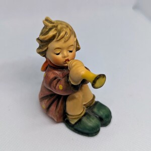 Girl with Trumpet Hummel Figurine.